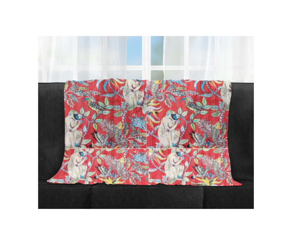 Handmade 100% cotton Kantha blanket with colorful monkey print on red background, lightweight and breathable throw quilt made in India.