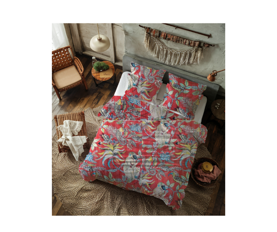 Colorful cotton Kantha blanket with monkey print on bed in rustic bedroom setting