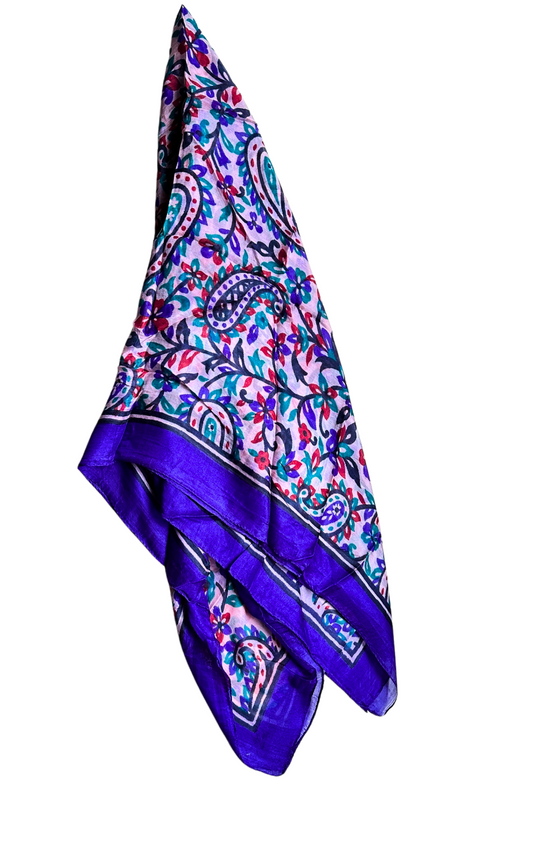 Lightweight hand-hemmed silk scarf with vibrant paisley and floral patterns in bright colors and purple border