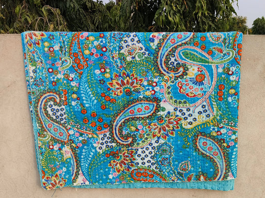 Handmade Kantha Blanket with vibrant blue paisley and floral patterns, lightweight 100% cotton quilt set from India.