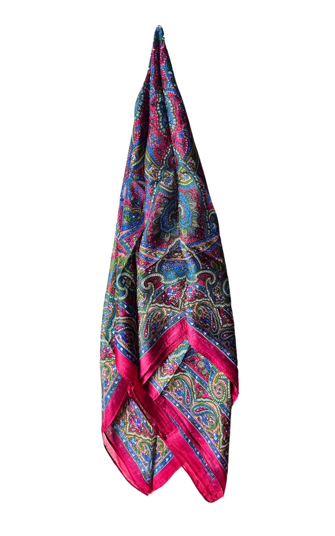 Hand-hemmed silk scarf with vibrant paisley pattern and pink border, lightweight and luxurious accessory.