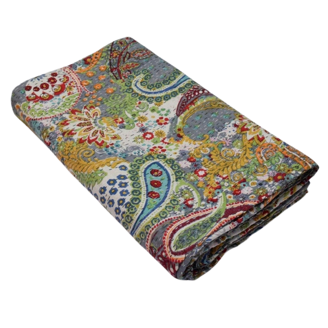 Folded colorful paisley patterned handmade cotton Kantha blanket quilt with intricate hand stitching