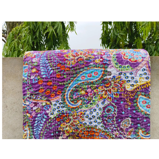 Colorful paisley patterned Kantha blanket made of lightweight, hand-stitched 100% cotton voile with floral and leaf motifs.