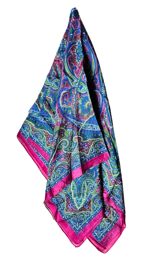 Lightweight and luxurious hand-hemmed silk scarf in vibrant colors.