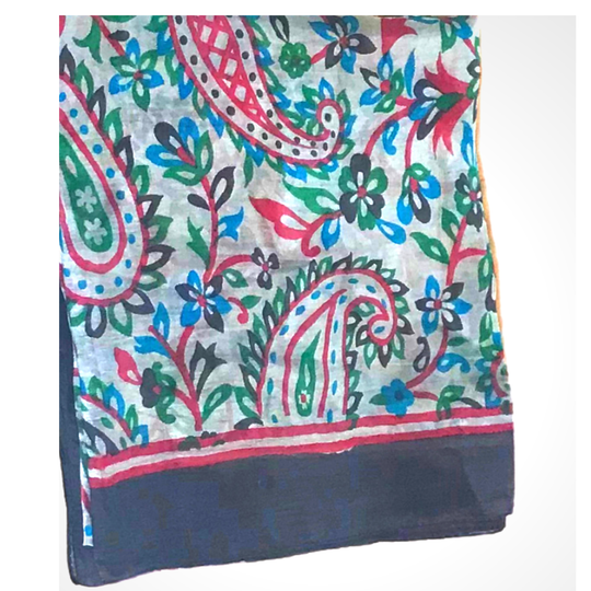 Lightweight hand-hemmed silk scarf with vibrant floral and paisley patterns in bright colors
