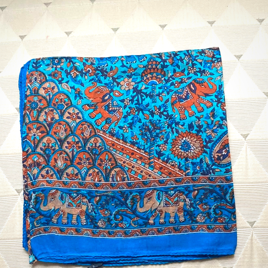 Blue lightweight silk scarf with hand-hemmed edges and intricate elephant and floral patterns