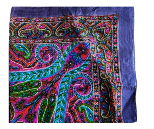 Colorful hand-hemmed lightweight silk scarf with intricate floral patterns and vibrant hues