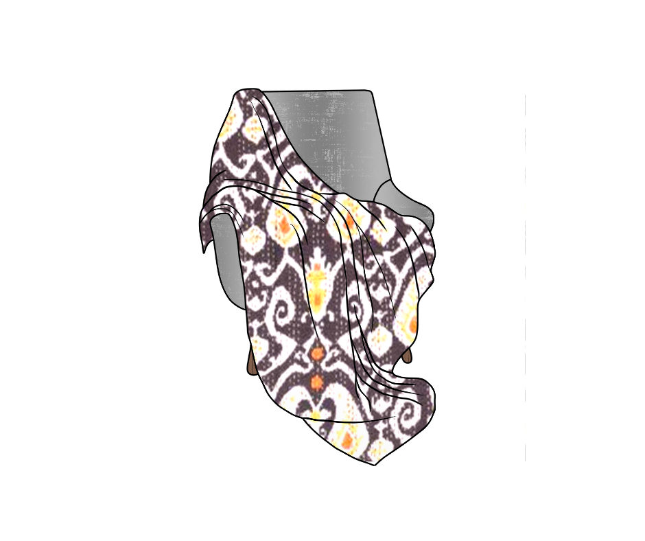 Handmade Kantha blanket with Ikat design draped over a chair, featuring vibrant traditional pattern and lightweight cotton voile fabric.