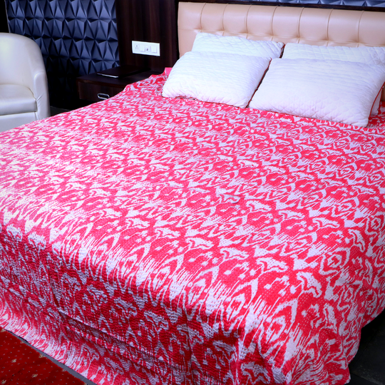 Red and white ikat design Kantha blanket on bed with pillows, handmade quilt set, lightweight cotton bedspread